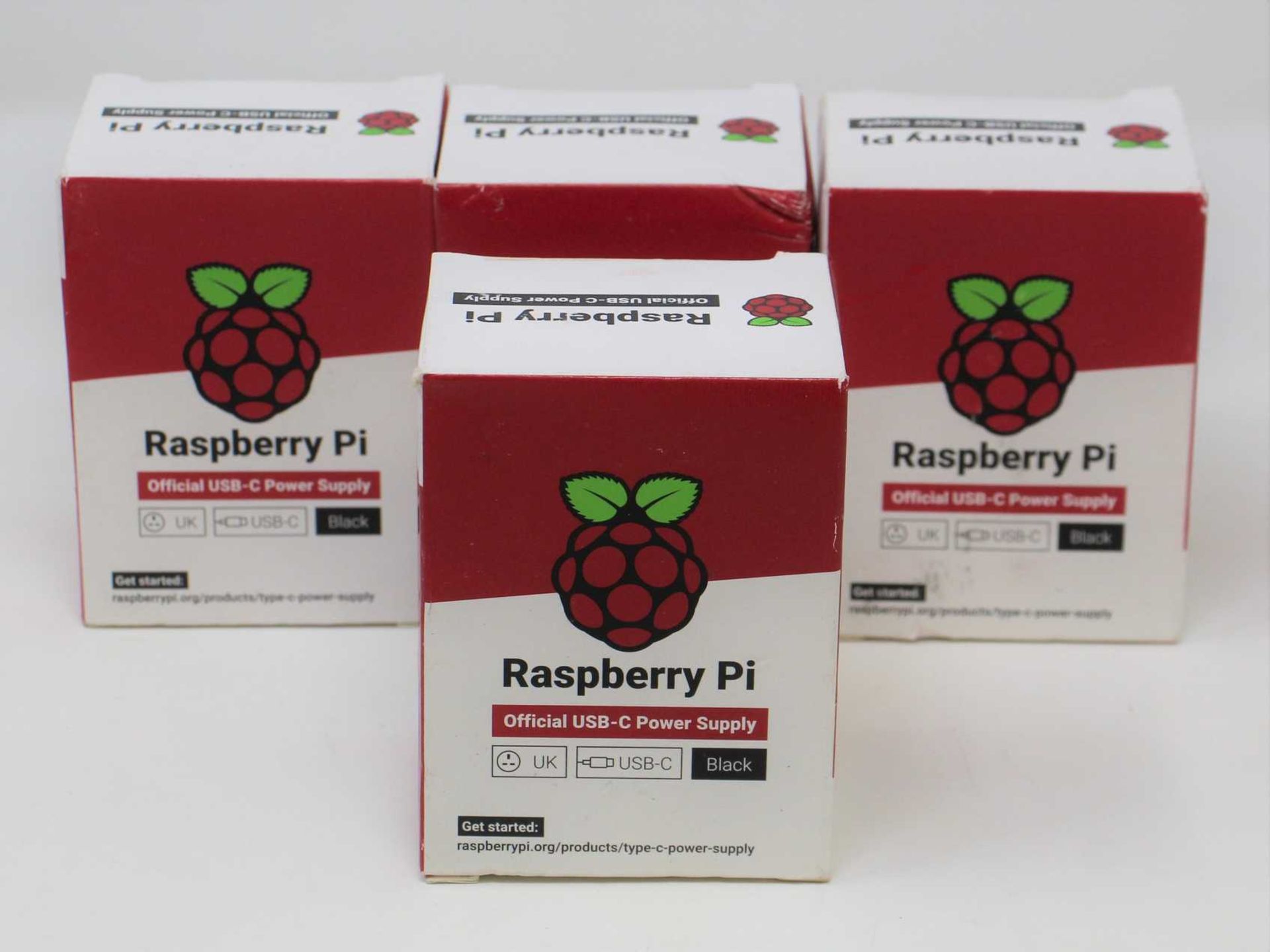 Four boxed as new Raspberry Pi 15.3W USB-C Power Supplies (UK model, Black) (Some damage to boxes).