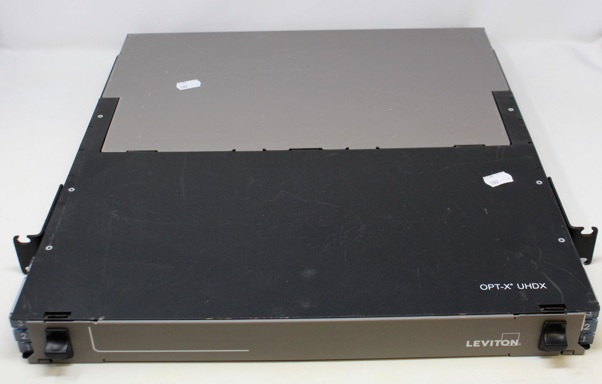 A pre-owned Leviton OPT-X UHDX 1RU Fiber Enclosure (Untested, sold as seen).