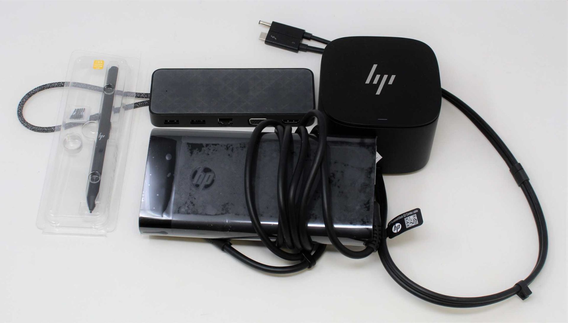 A pre-owned HP Thunderbolt Dock G2 230W with Combo Cable, a pre-owned HP 230W Power Adaptor, a pre-