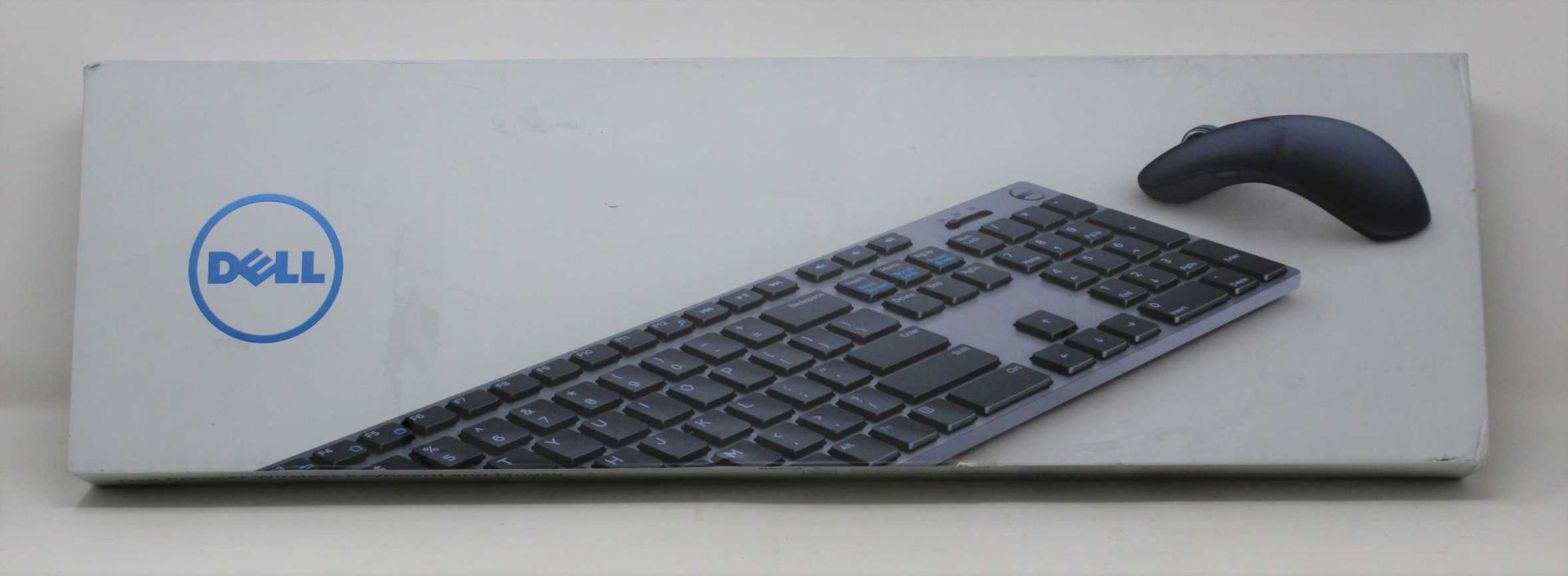 A boxed as new Dell KM717 Premier Keyboard And Mouse Set (VPN: KM717-GY-UK) (Box sealed, some damage