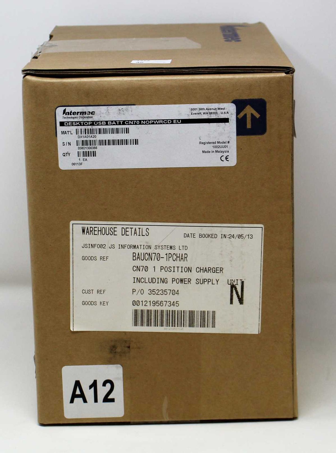 A boxed as new Intermec DX1A01A20 Single Bay CN70 Barcode Scanner Charger and Battery Charger.