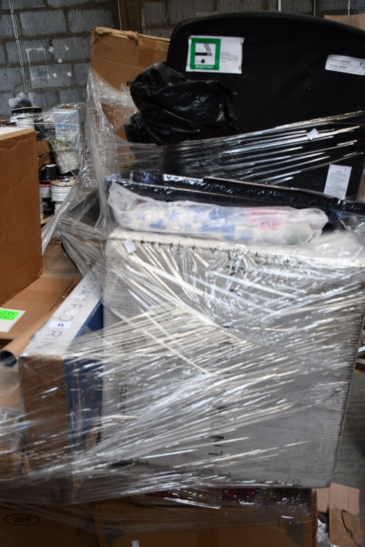A pallet of miscellaneous furniture and related items.