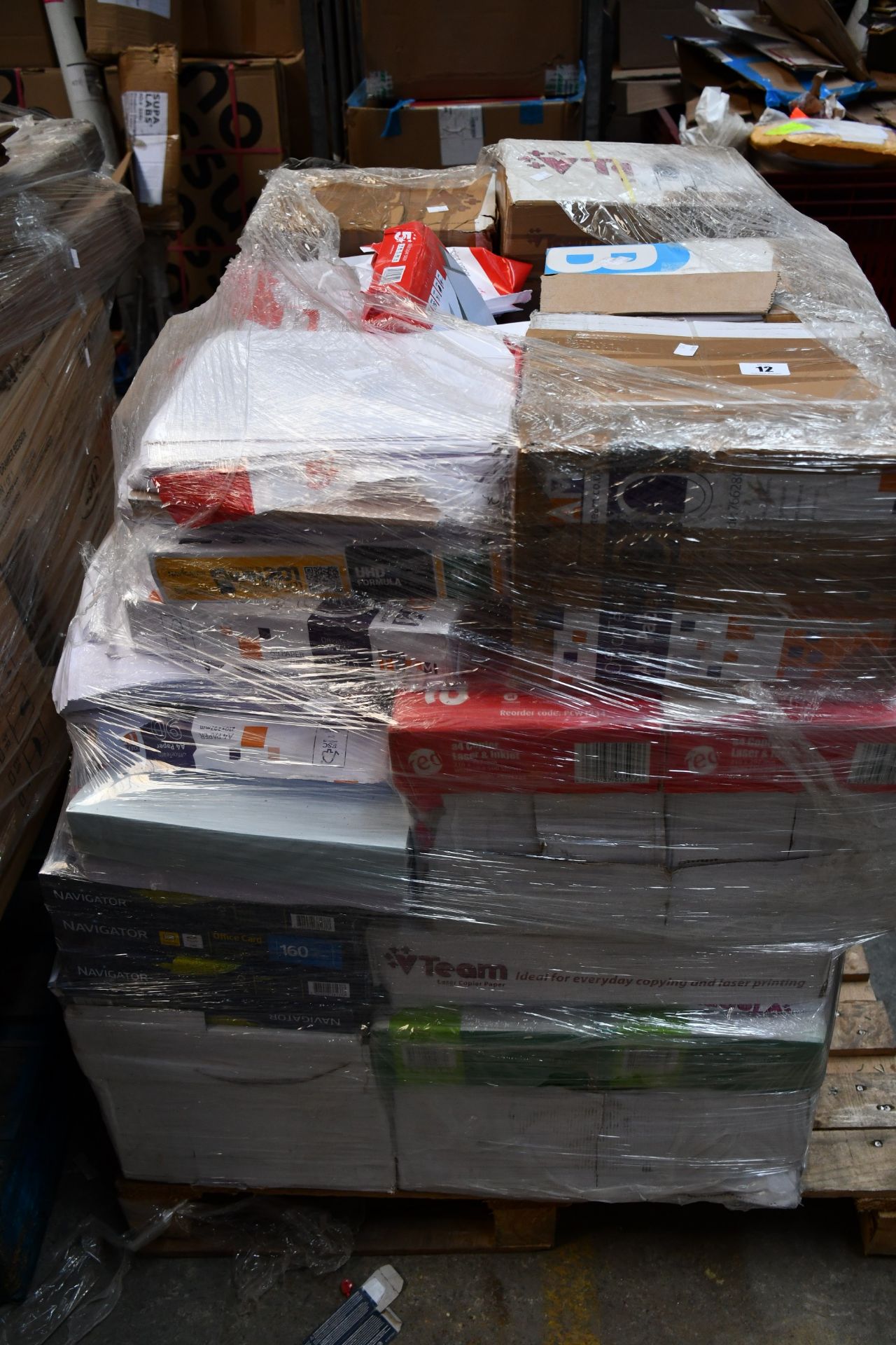 A pallet of assorted printer paper.