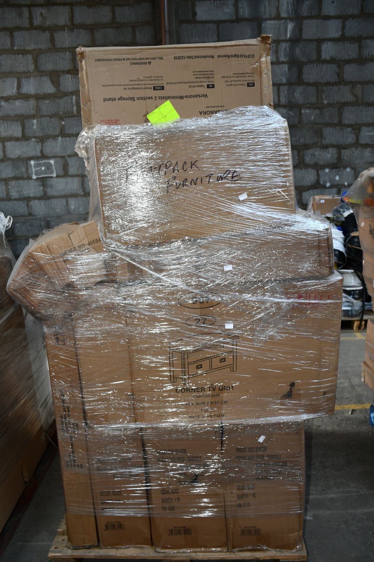 A pallet of miscellaneous flat pack furniture, household and related items.