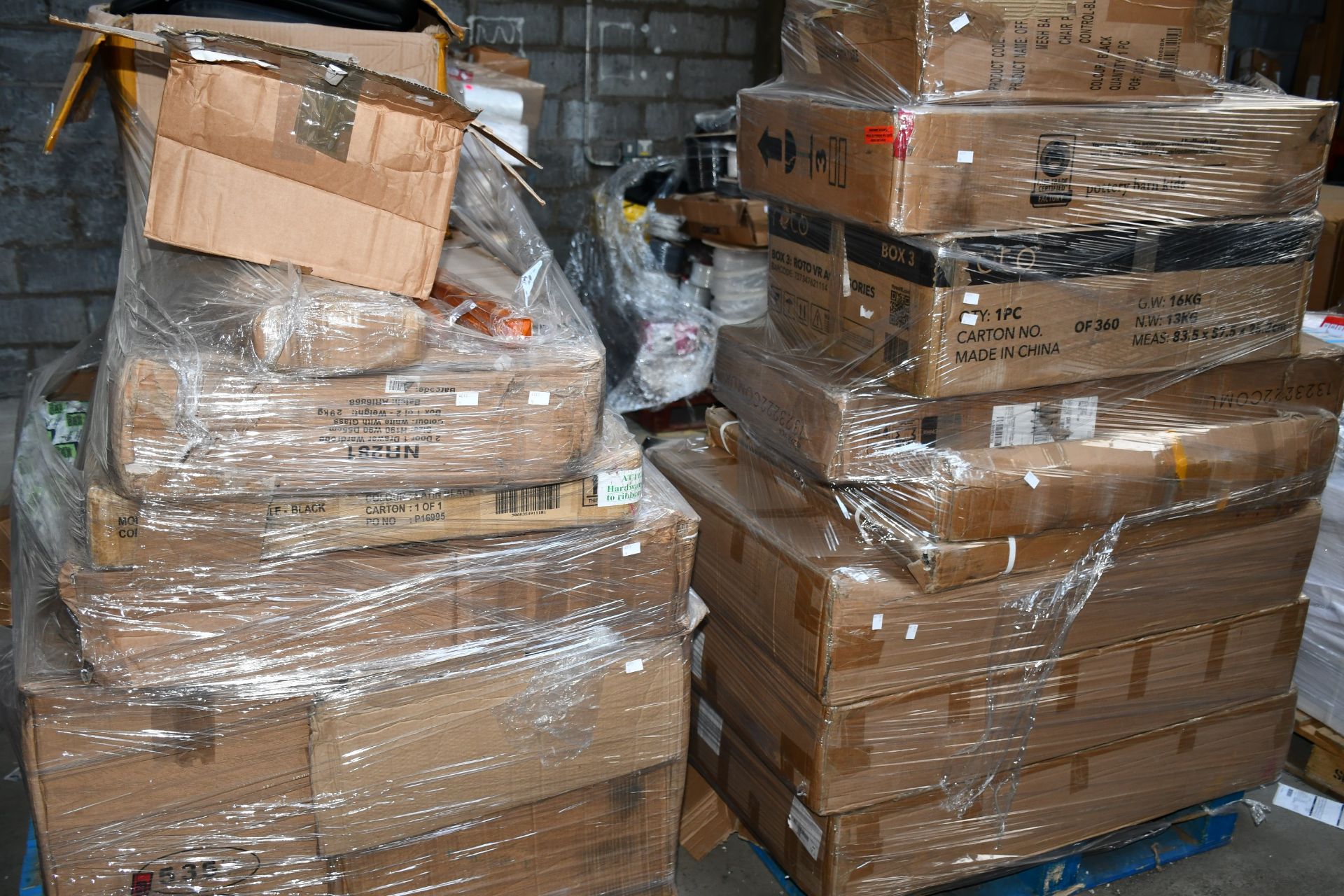 A pallet of miscellaneous flat pack furniture, household and related items.