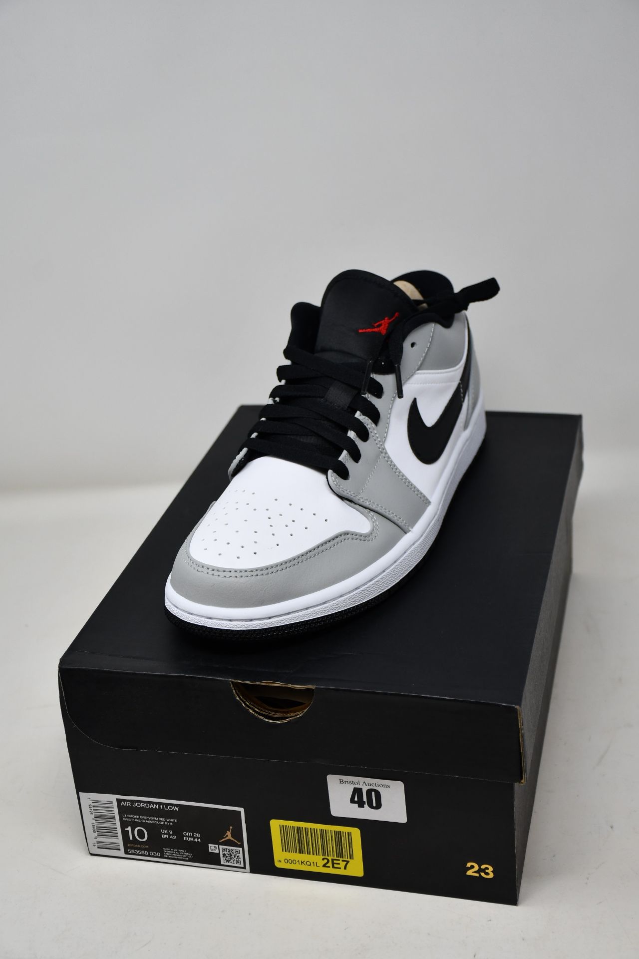 A pair of as new Nike Air Jordan 1 Low in smoke grey (UK 9).