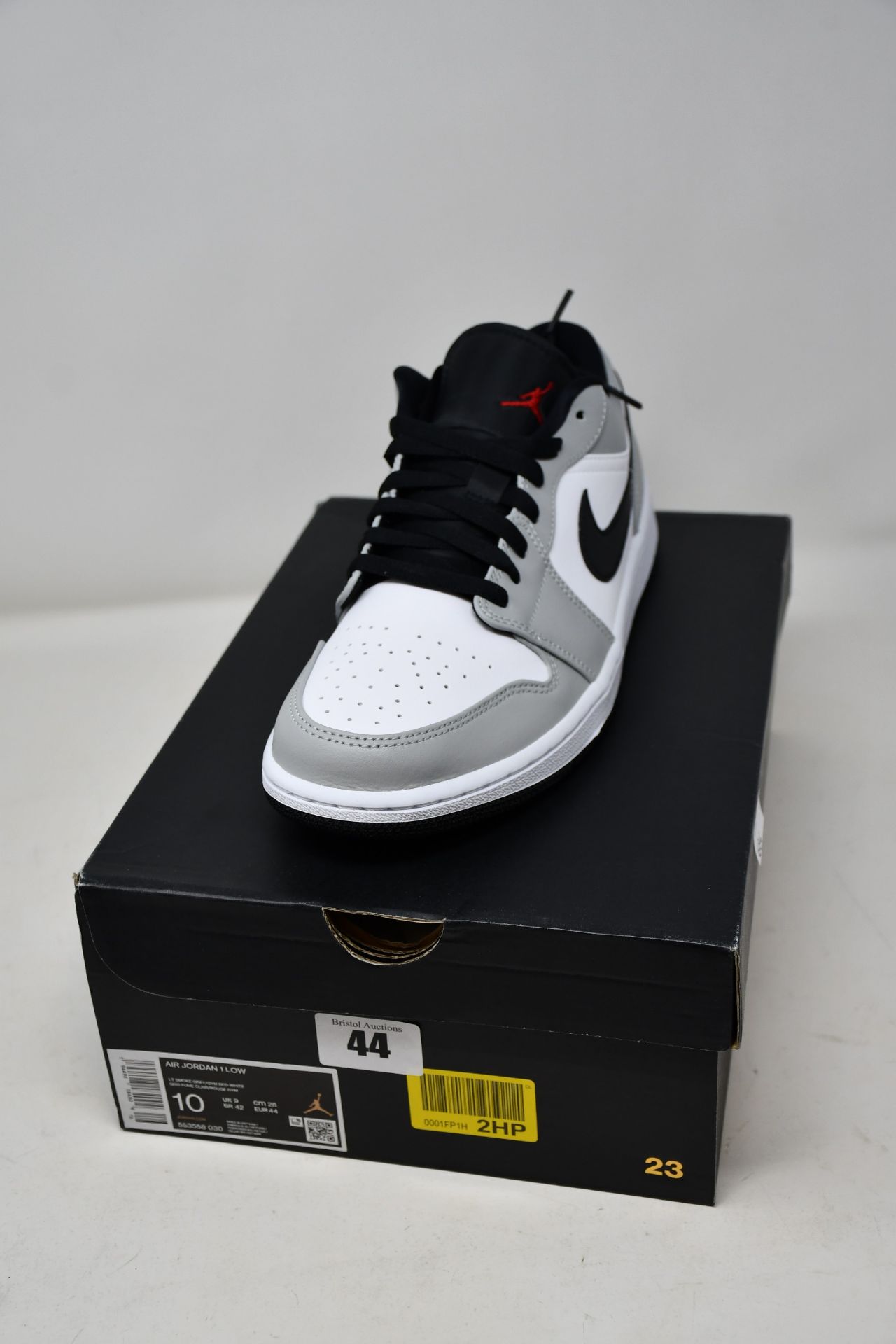 A pair of as new Nike Air Jordan 1 Low in smoke grey (UK 9).