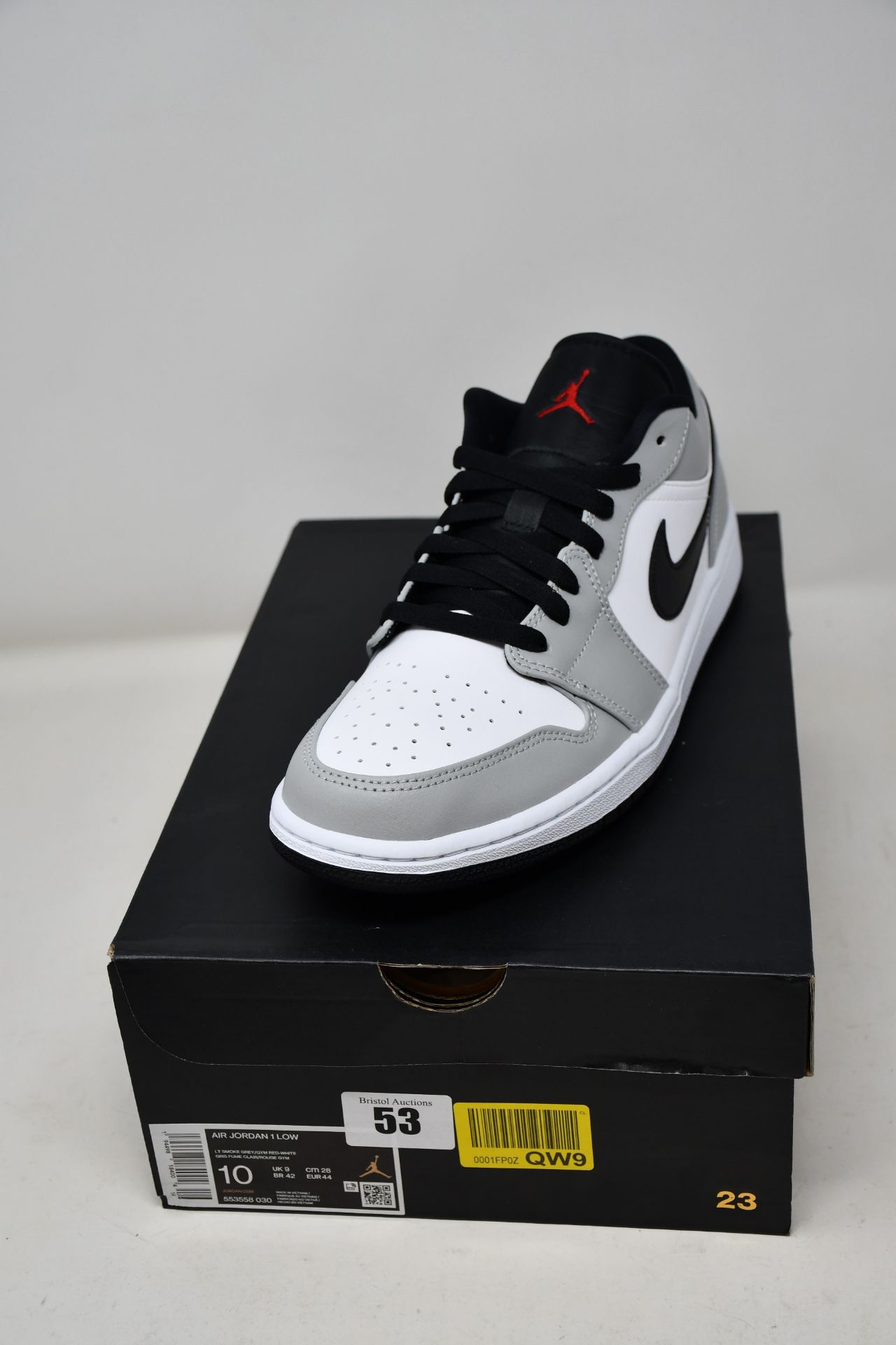 A pair of as new Nike Air Jordan 1 Low in smoke grey (UK 9).