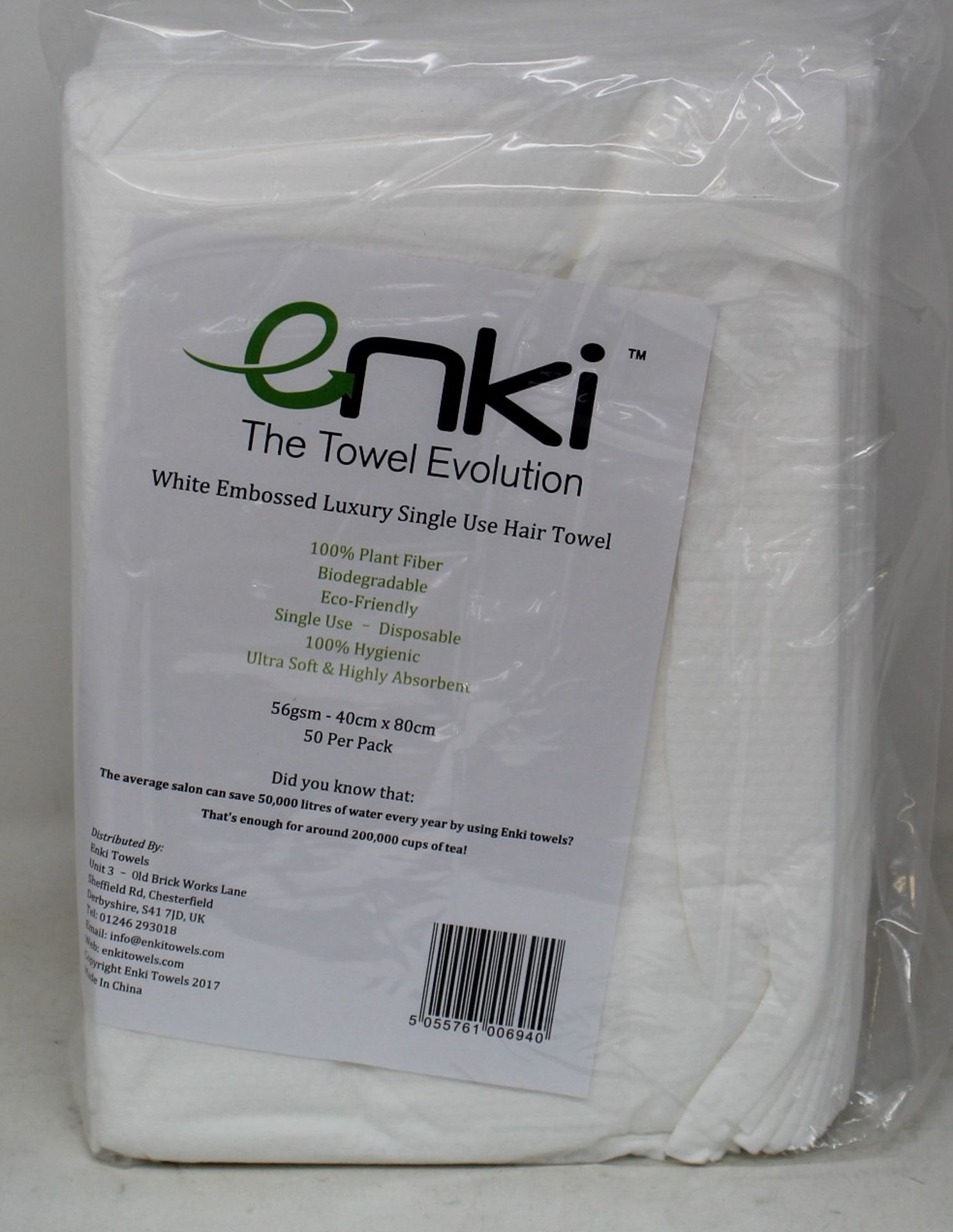 Eighteen packs of 50 Enki The Towel Evolution Luxury single use hair towels.