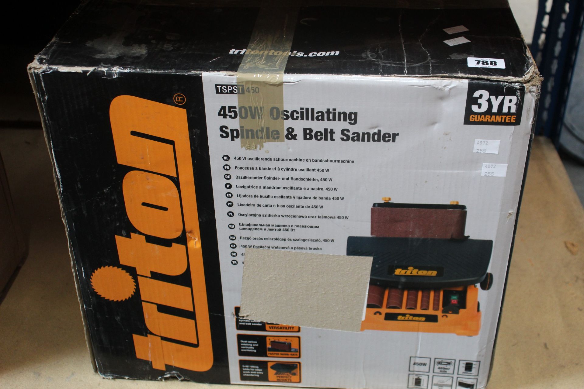 A boxed Triton TSPST450 Oscillating Spindle and Belt Sander (450W).