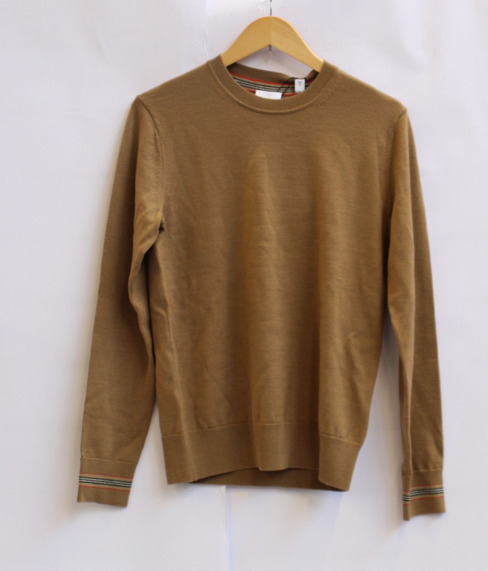 An as new Burberry brown sweater (XS).