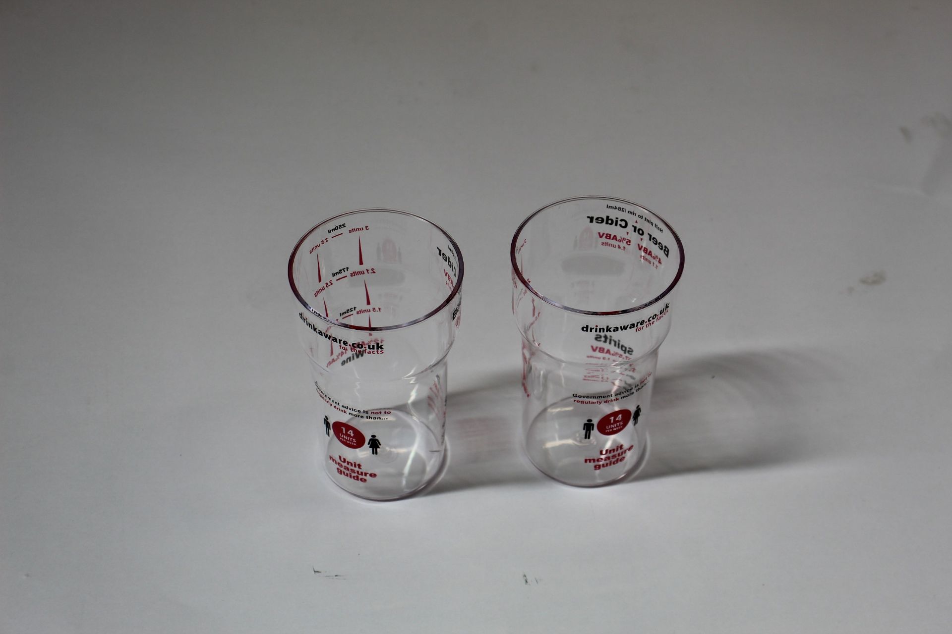 A large quantity of Drinkaware alcohol unit measuring cups (Approximately 250 items).