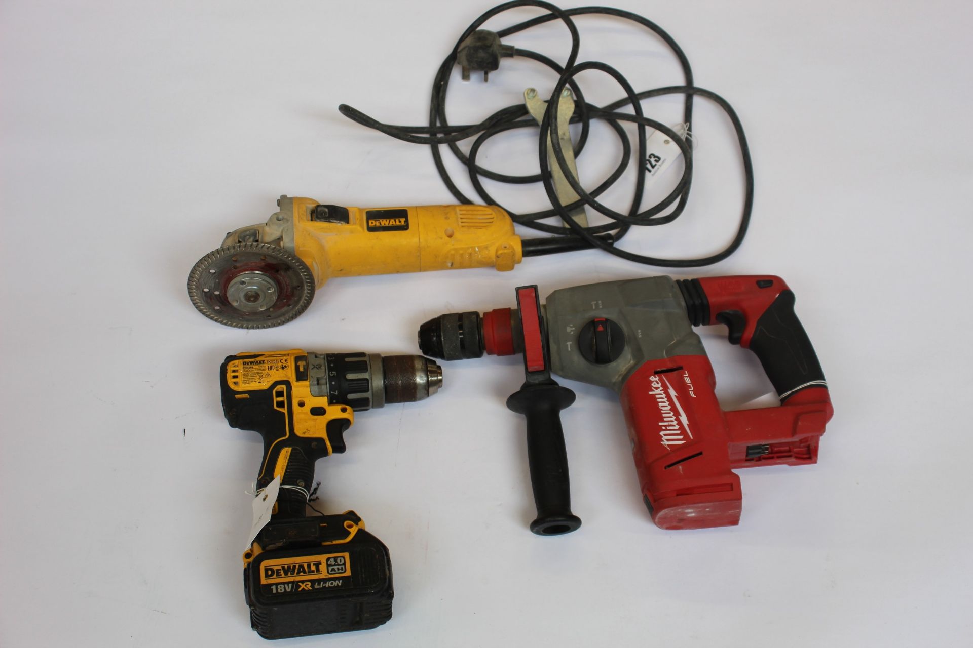 A Milwaukee M18 CHX Hammer Drill (Unit only), a DeWalt DCD 796 Combi Drill (With Battery, no