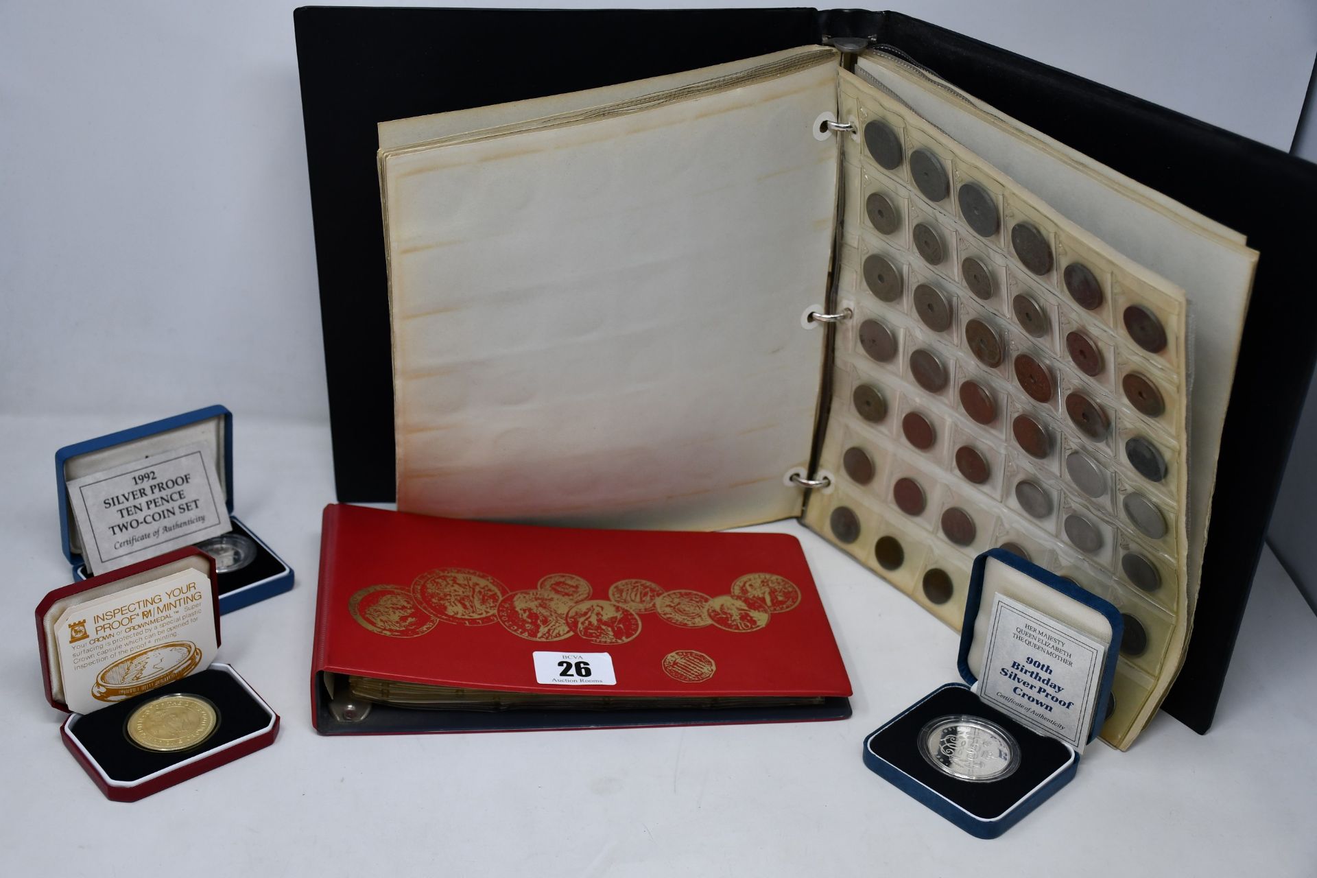 A box of World Collection coins to include some silver crowns, etc.