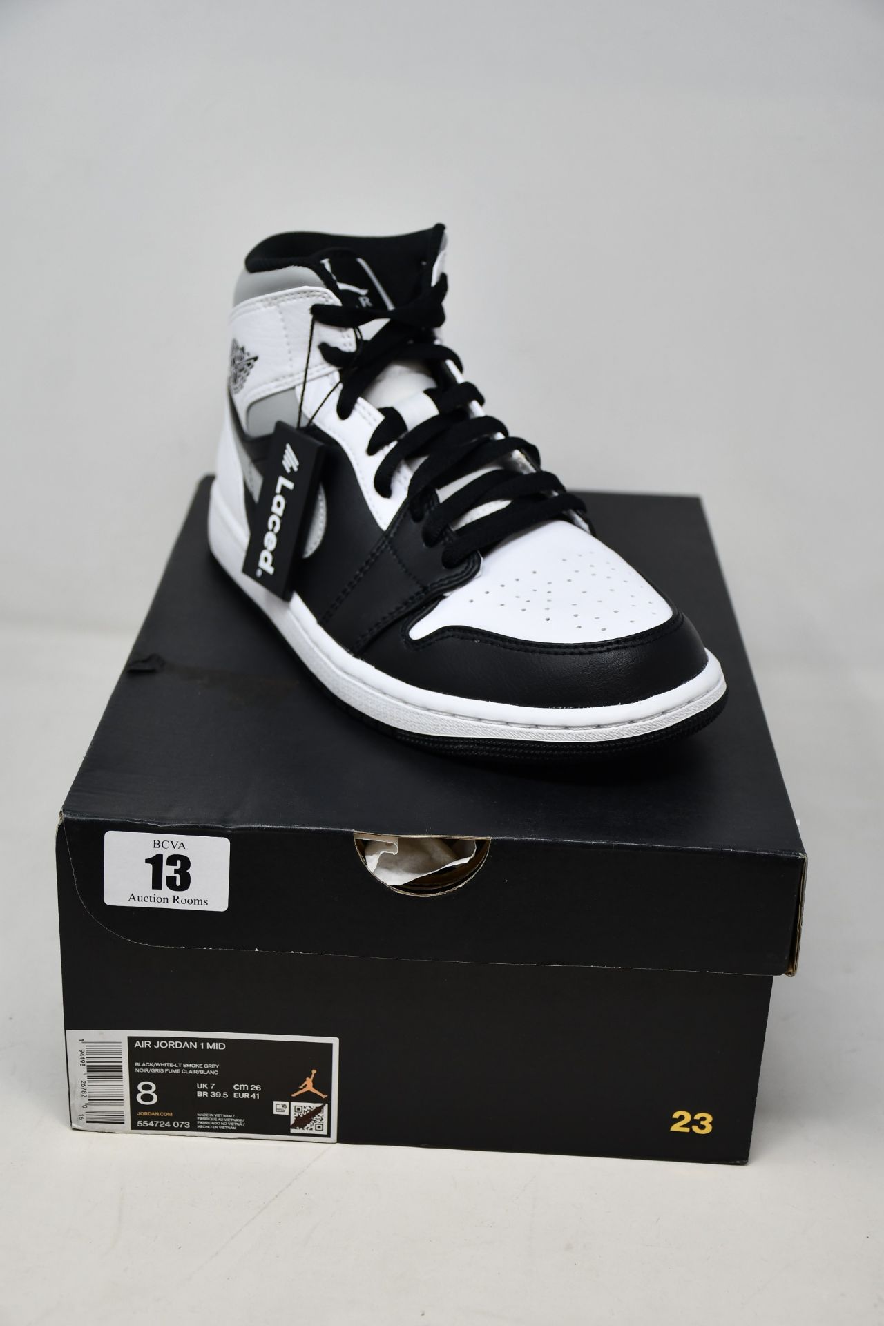 A pair of as new Nike Air Jordan 1 Mid (UK 7).