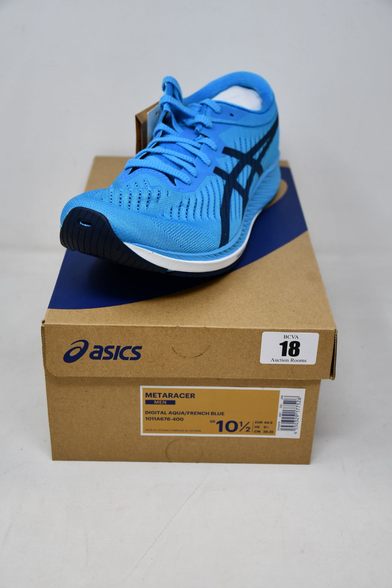 A pair of as new Asics Metaracer trainers (UK 9.5).