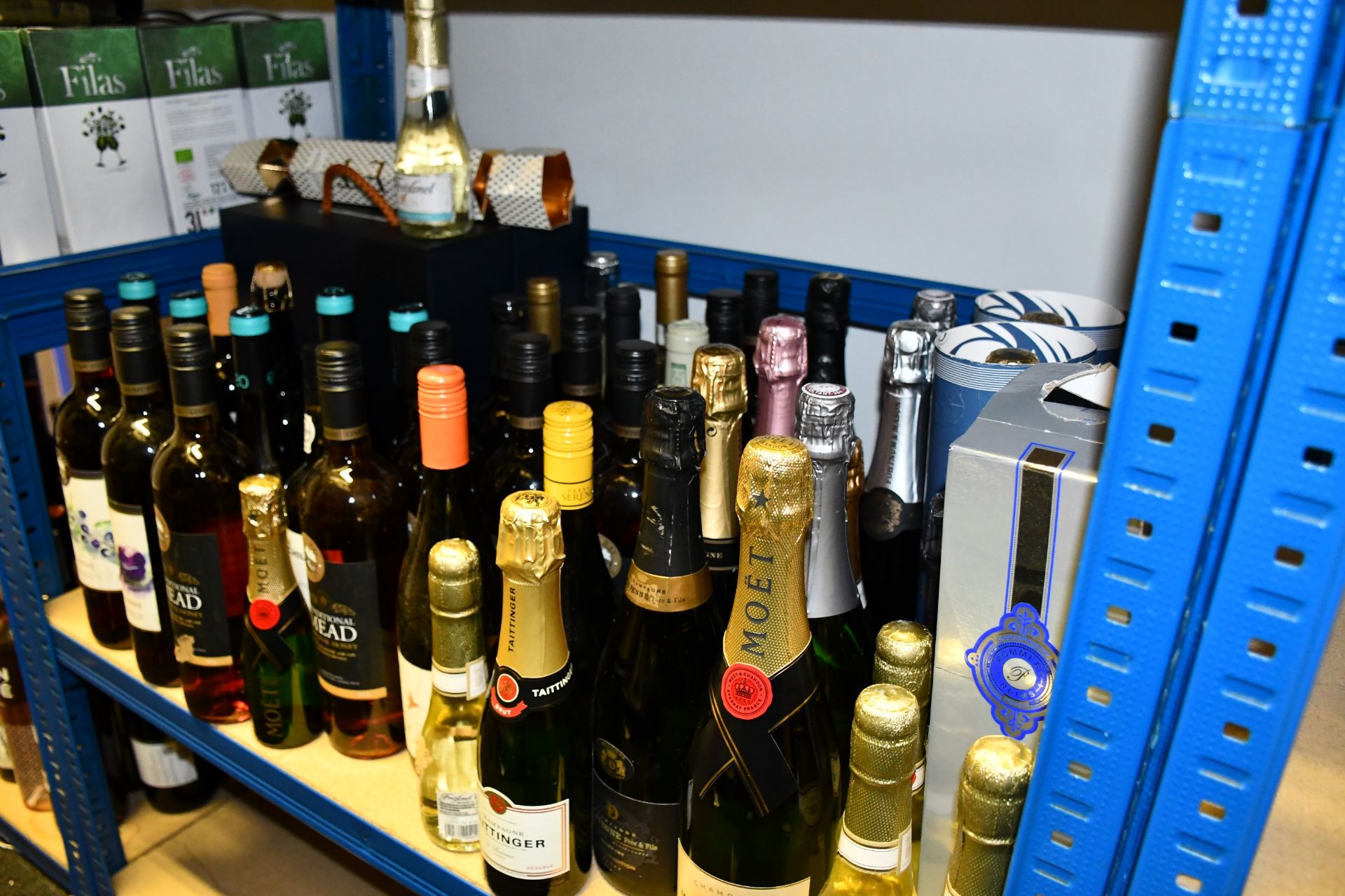 A shelf containing wines/champagnes to include Taittinger, Mead, Moet and Chandon (Over 18s only).