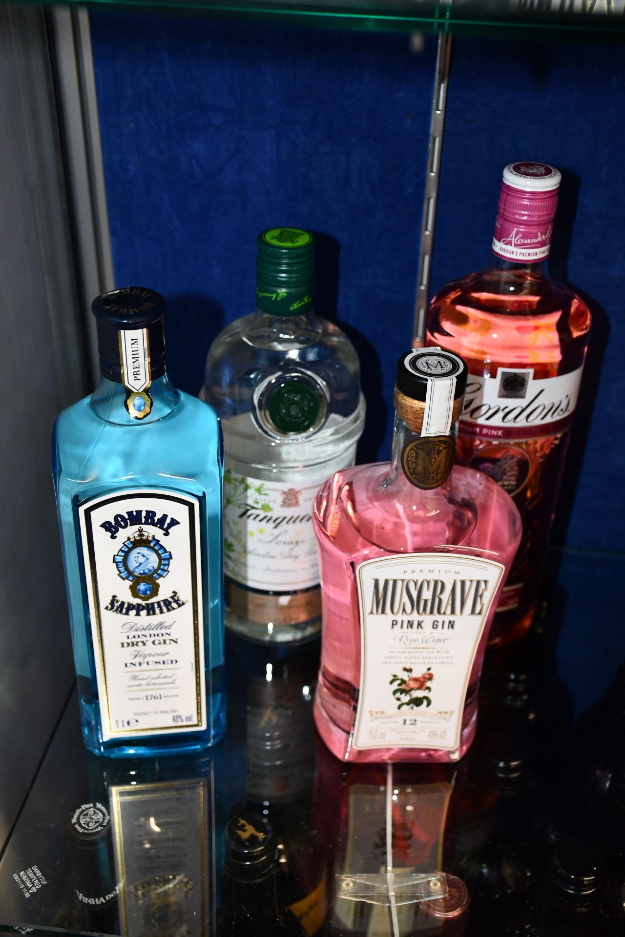 A bottle of Bombay Sapphire London gin (1ltr), a Tanqueray limited edition Lovage London dry gin (