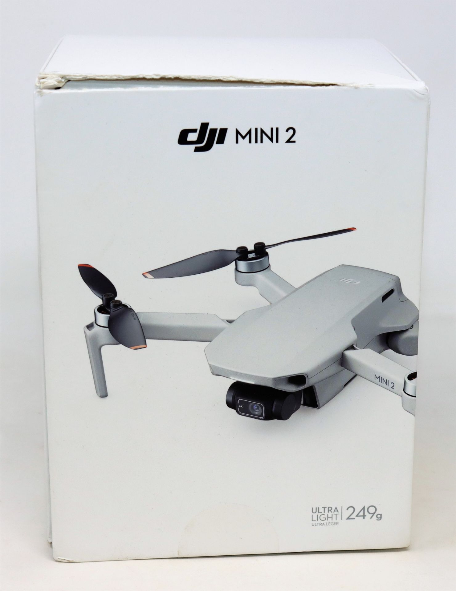 A boxed as new DJI Mini 2 4K Ultra-Light Drone (Model: GL MT2PD RC231) (Box opened, damaged box).