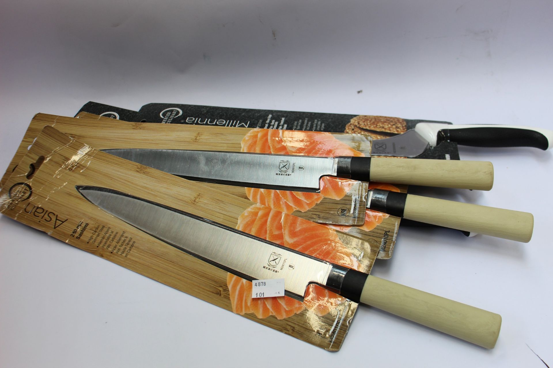 A quantity of as new Mercer Culinary knives to include three 240mm Sashimi knives, three 9" bread