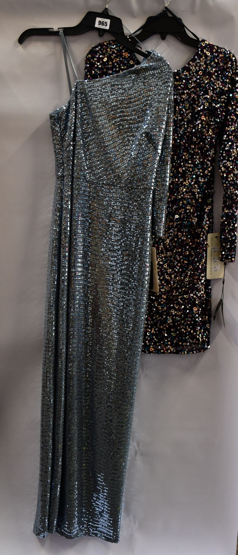 An as new Adrianna Papell mirror foil one shoulder gown (Size 8) and an as new Adrianna Papell