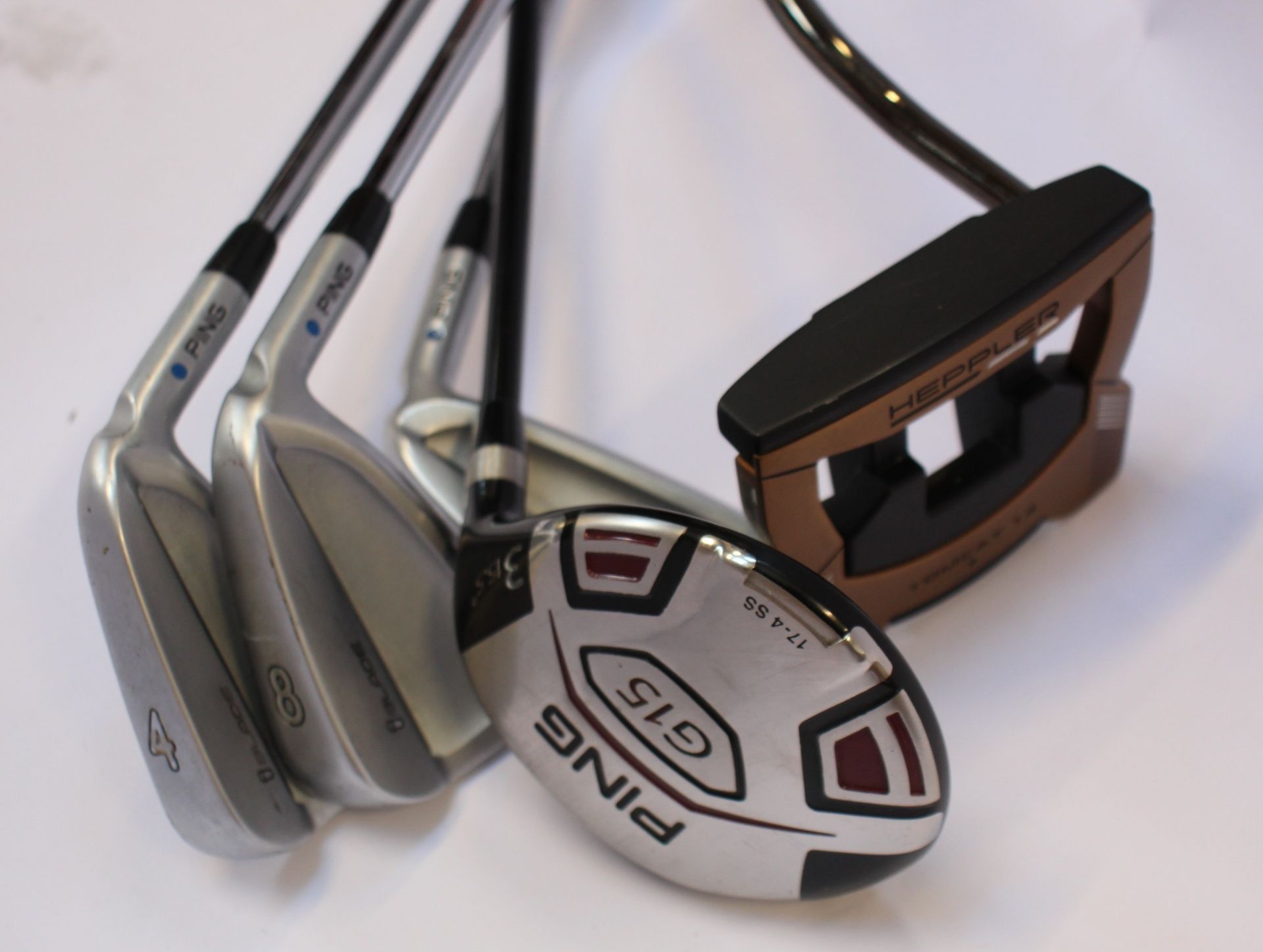 Five Ping golf clubs to include; Three Ping iBlade irons (4, 5 and 8), a Ping Heppler Tomcat 14