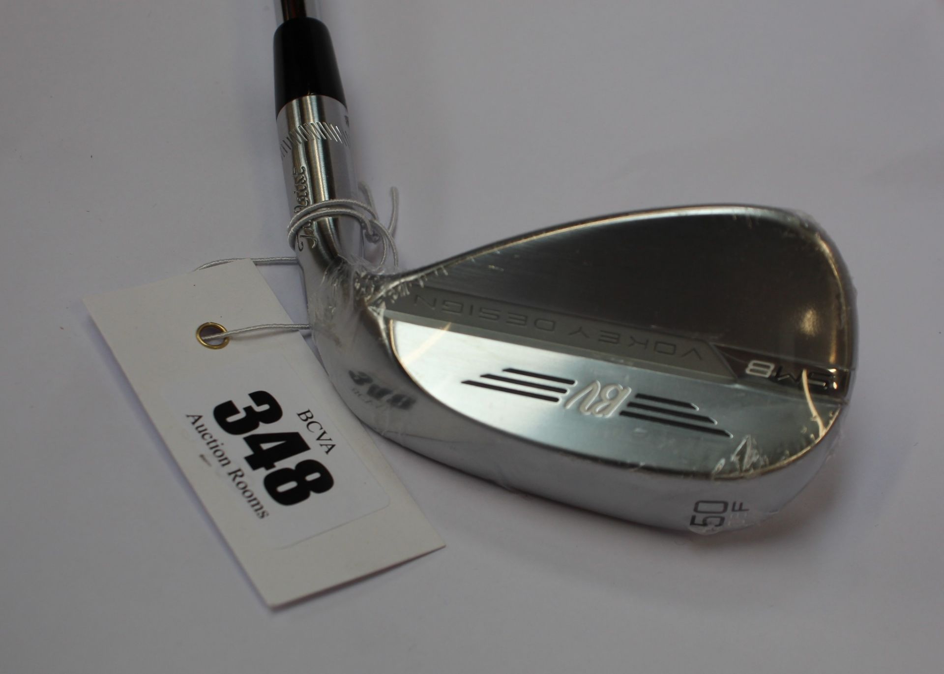 An as new Titleist Vokey Design SM8 wedge 50/08F (Right handed).