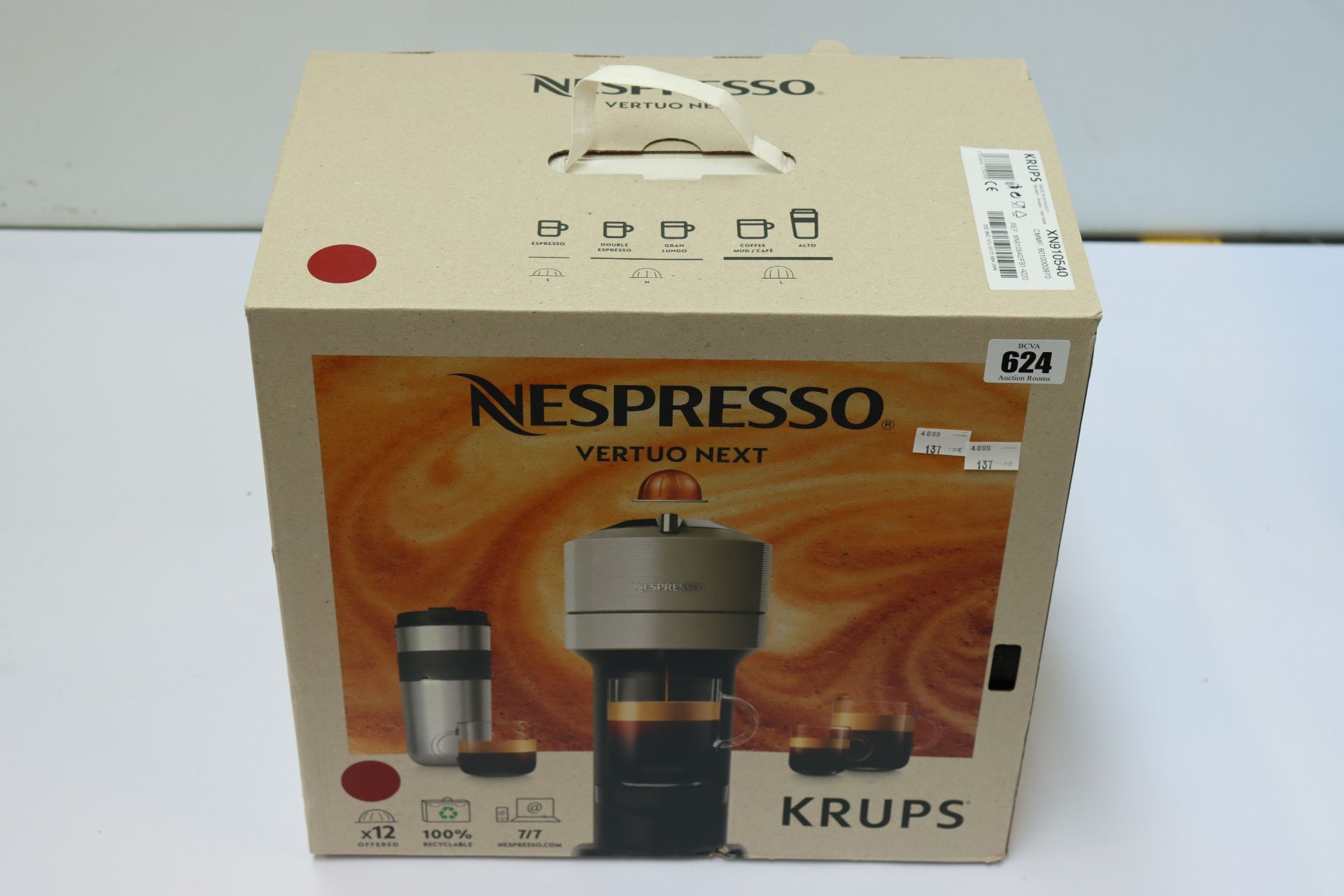 A boxed pre-owned Nespresso Vertuo Next coffee machine.