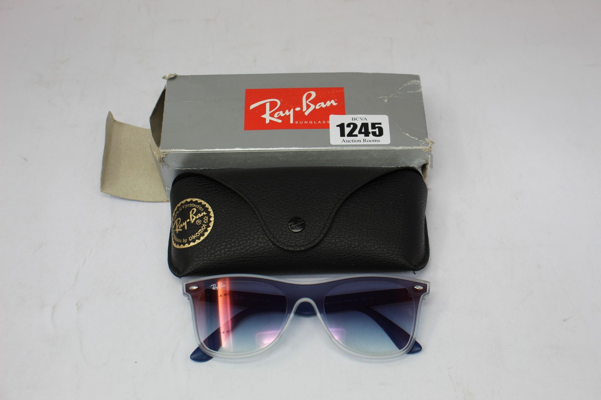 A pair of as new Ray Ban sunglasses.