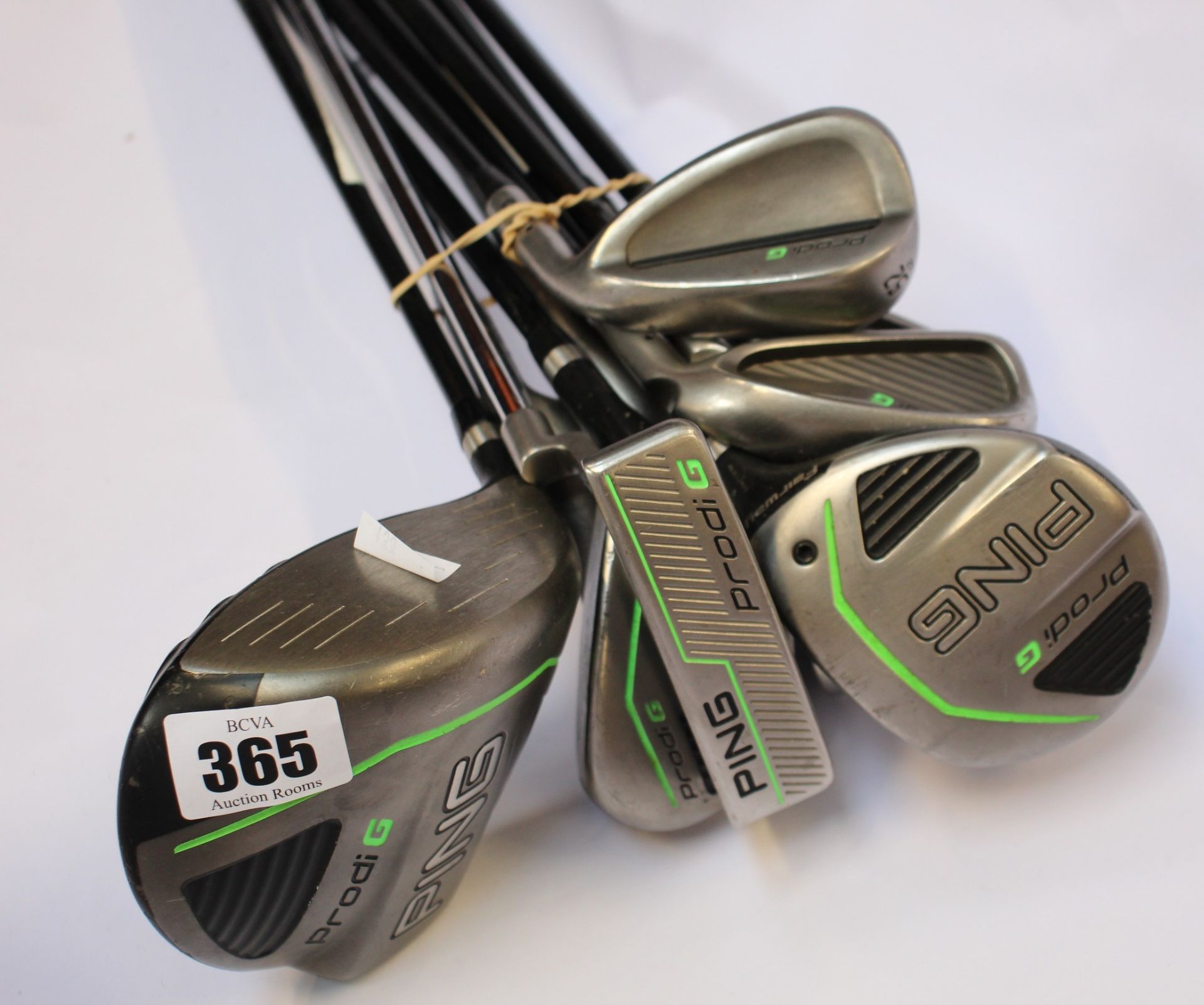A set of Pre-owned Ping Prodi G junior golf clubs to include; driver, fairway, hybrid, irons (6,7,