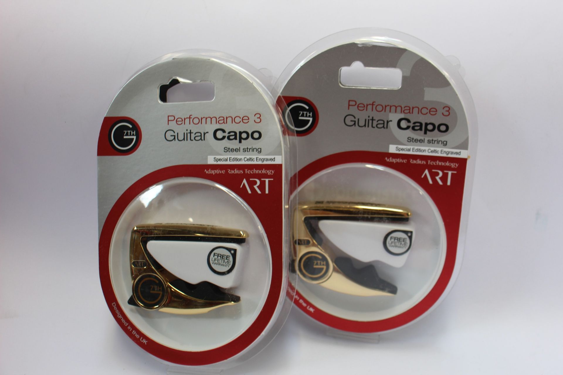 Three as new G7th Performance 3 Guitar Capos for steel strings (Special Edition Celtic Engraved).