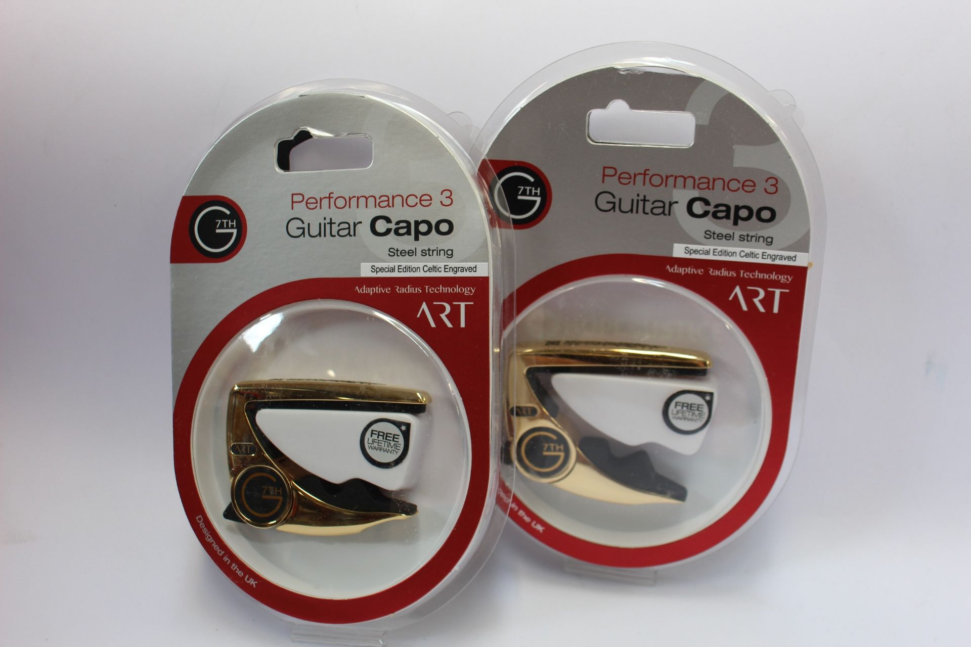 Three as new G7th Performance 3 Guitar Capos for steel strings (Special Edition Celtic Engraved).