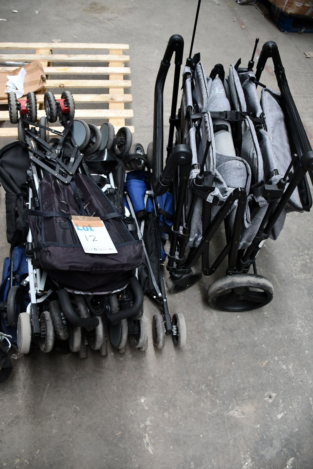 Four pre-owned pushchairs/buggies and a trolley.