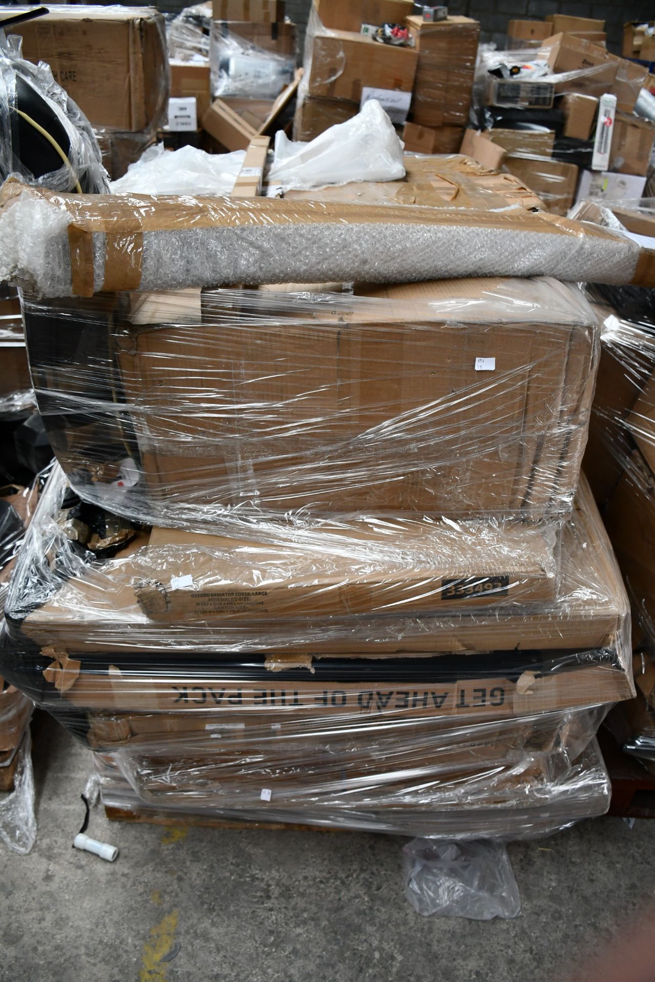 A pallet of assorted flat packed furniture and related items (BCVA cannot guarantee to be