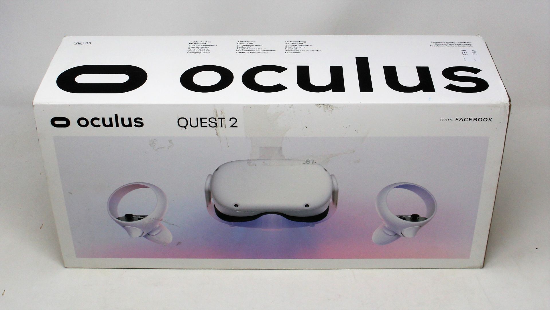 A boxed as new Oculus Quest 2 64GB VR Headset and hand controllers in white (damage to box sleeve)