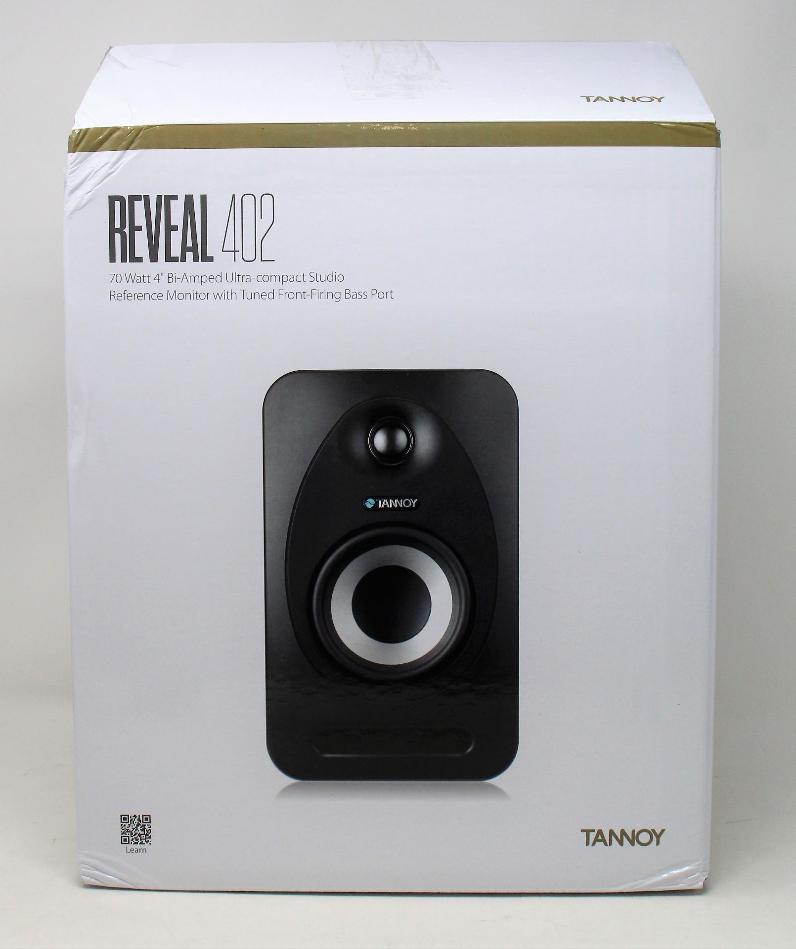 A boxed as new Tannoy Reveal 402 studio monitor in black