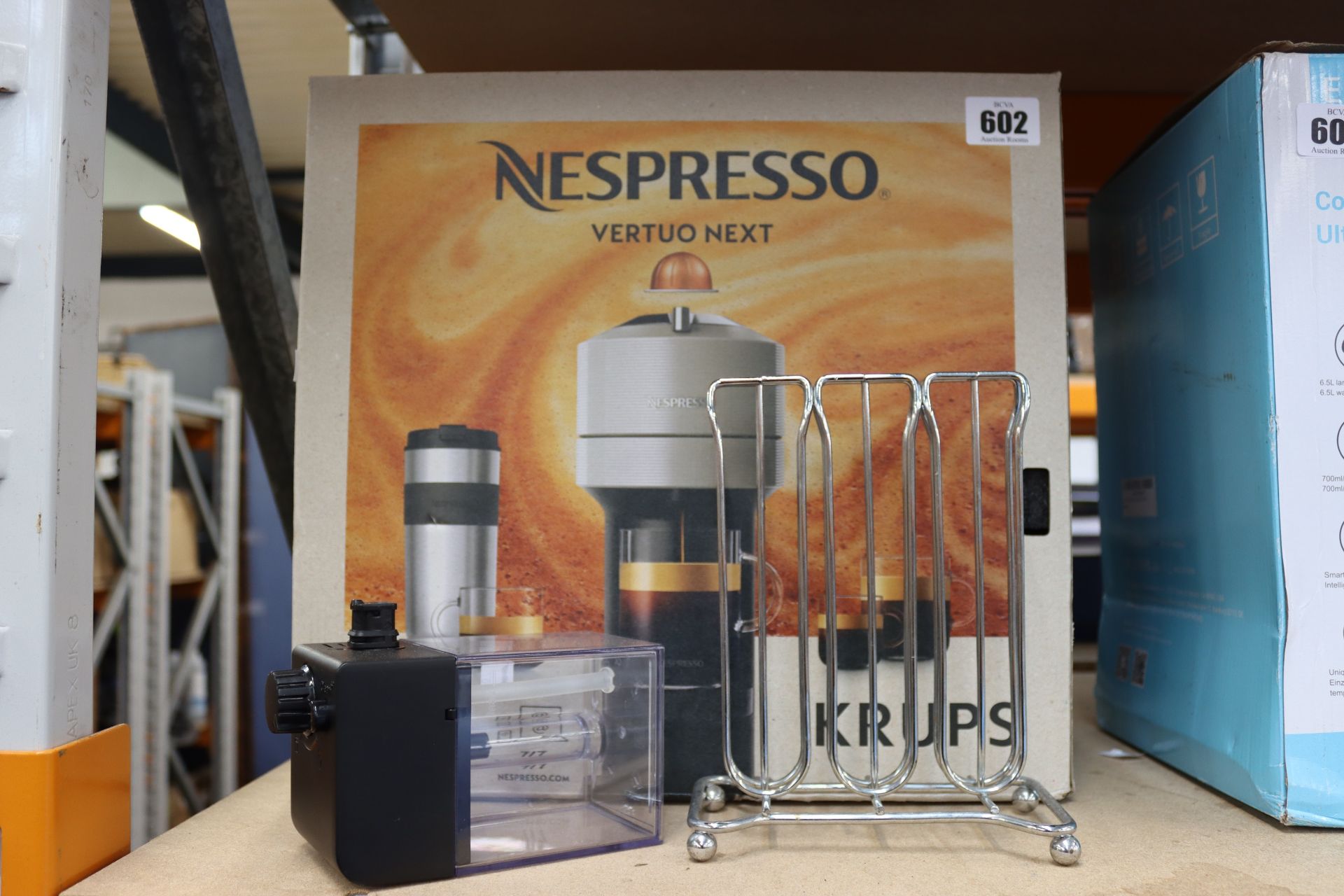 A boxed pre-owned Nespresso Vertuo Next coffee machine.