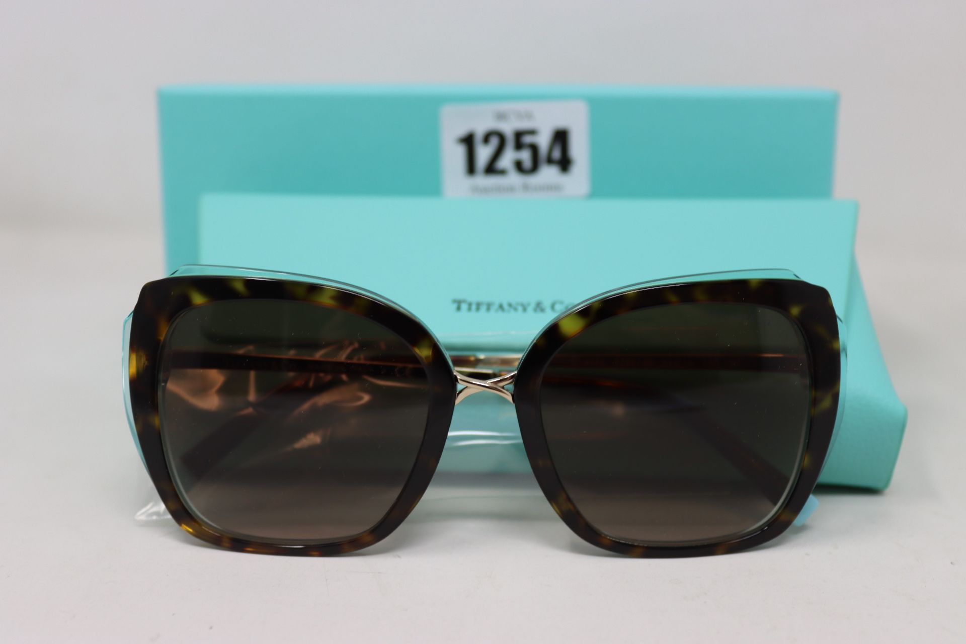 A pair of ladies boxed as new Tiffany & Co. Sunglasses (TF4160 82863B 54).
