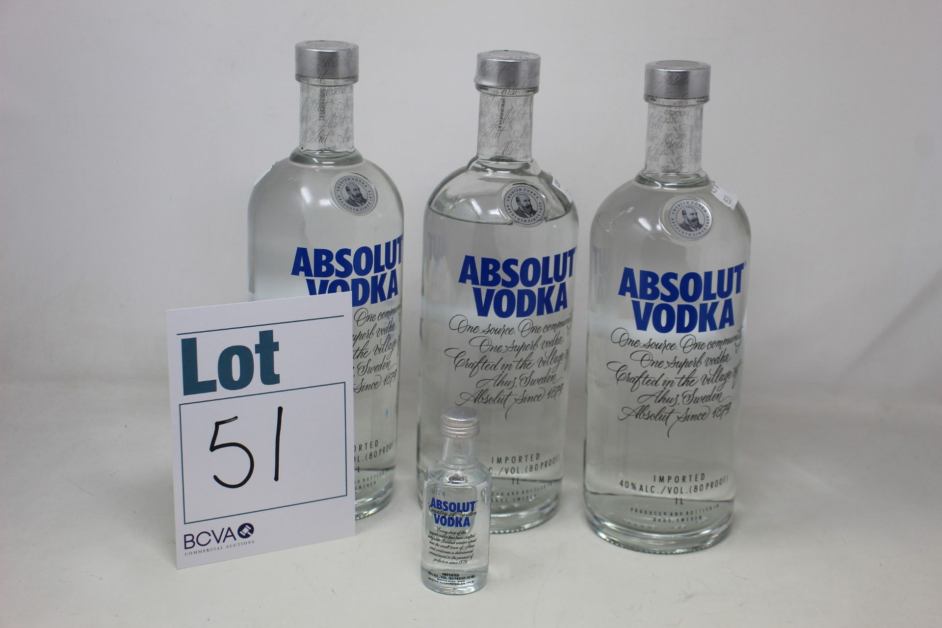 Three bottles of Absolut vodka (1ltr) together with a miniature (Over 18's only).