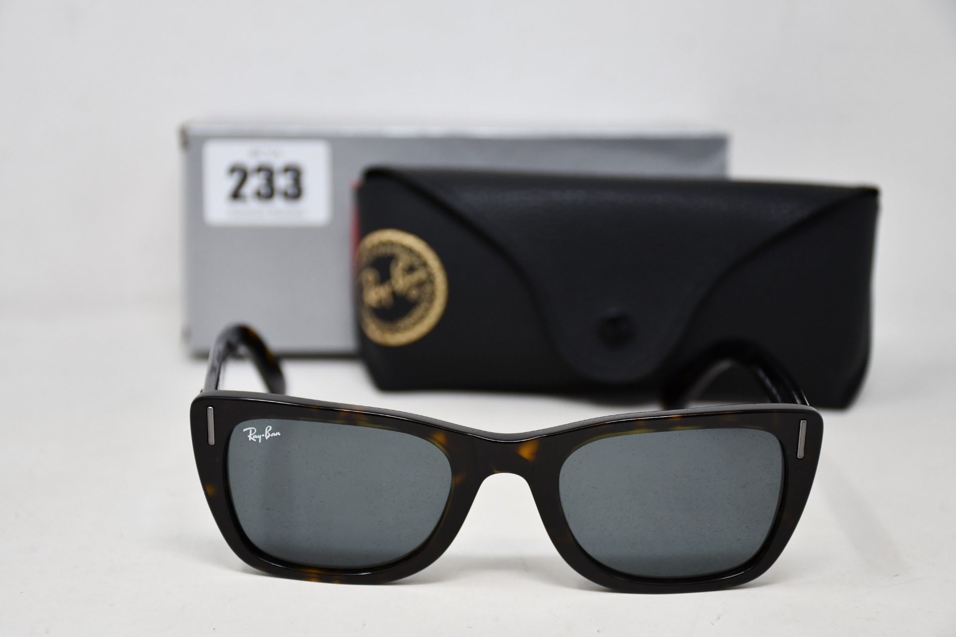 A pair of as new Ray Ban sunglasses.