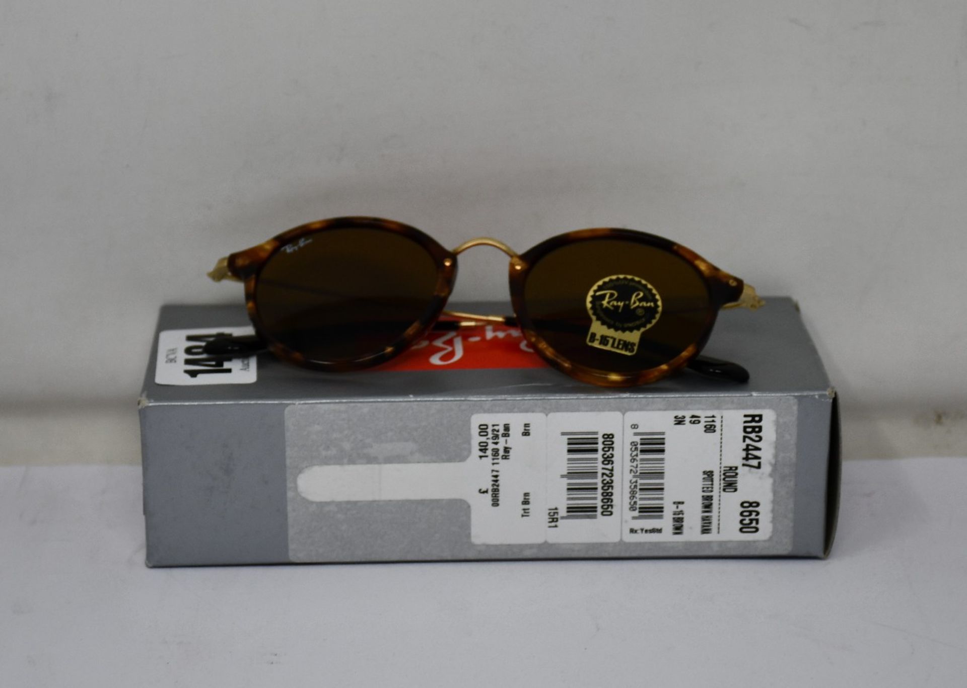 A pair of as new Ray Ban Round sunglasses.