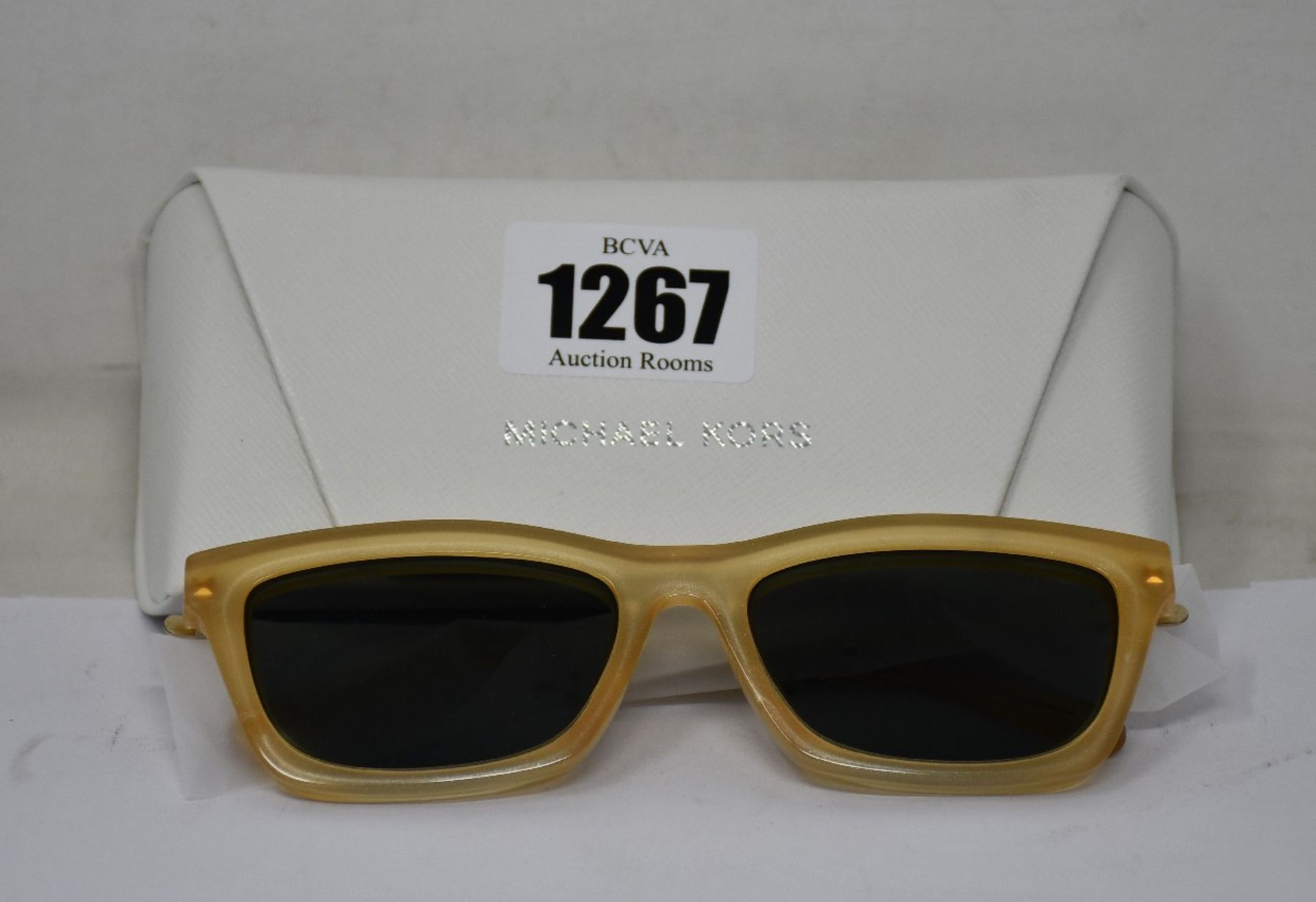 A pair of as new Michael Kors sunglasses.