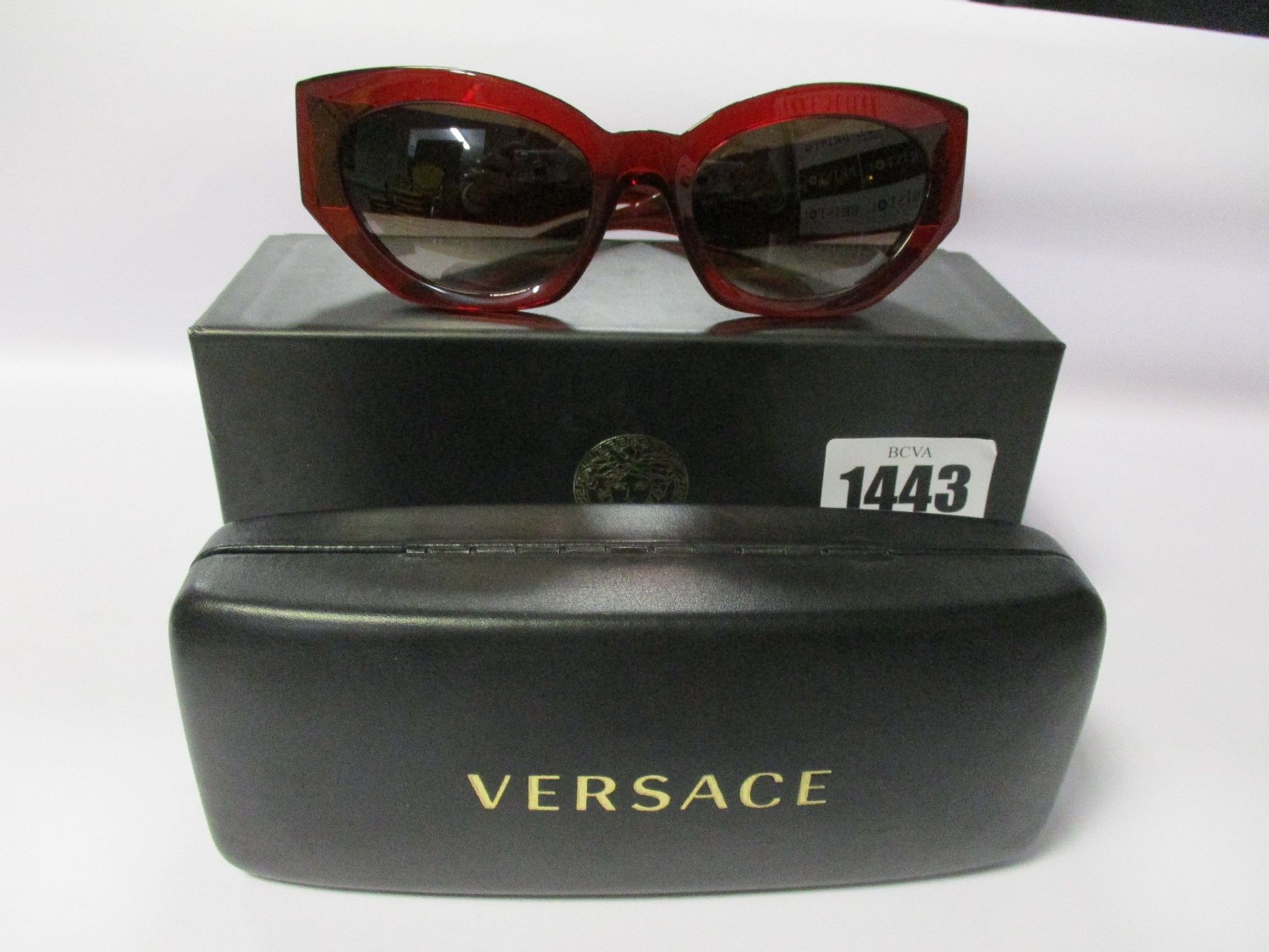 A pair of as new Versace sunglasses.