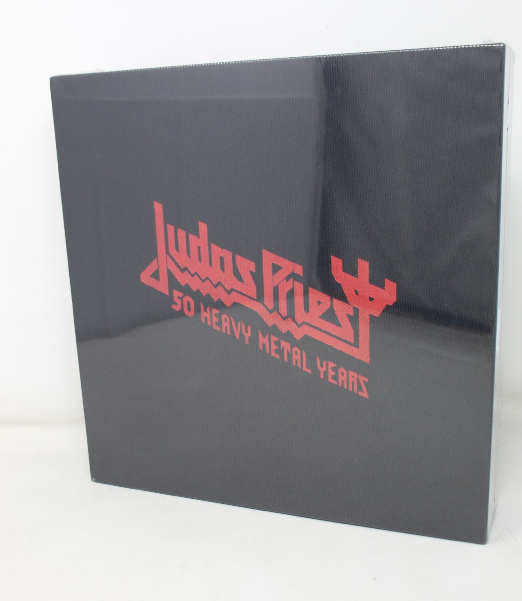 An as new Judas Priest 50 Heavy Metal Years collectors book.