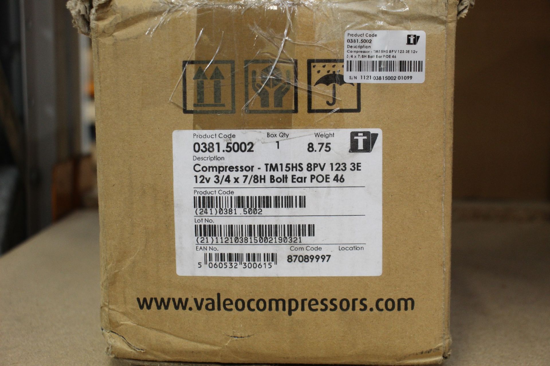 A Valeo refrigeration compressor (TM15HS 8PV 123 3E 12V 3/4 X 7/8 BOLT EAR POE 46).