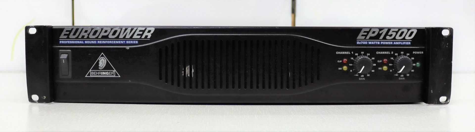 A pre-owned Behringer EP1500 power amplifier in black (Some cosmetic damage to casing).