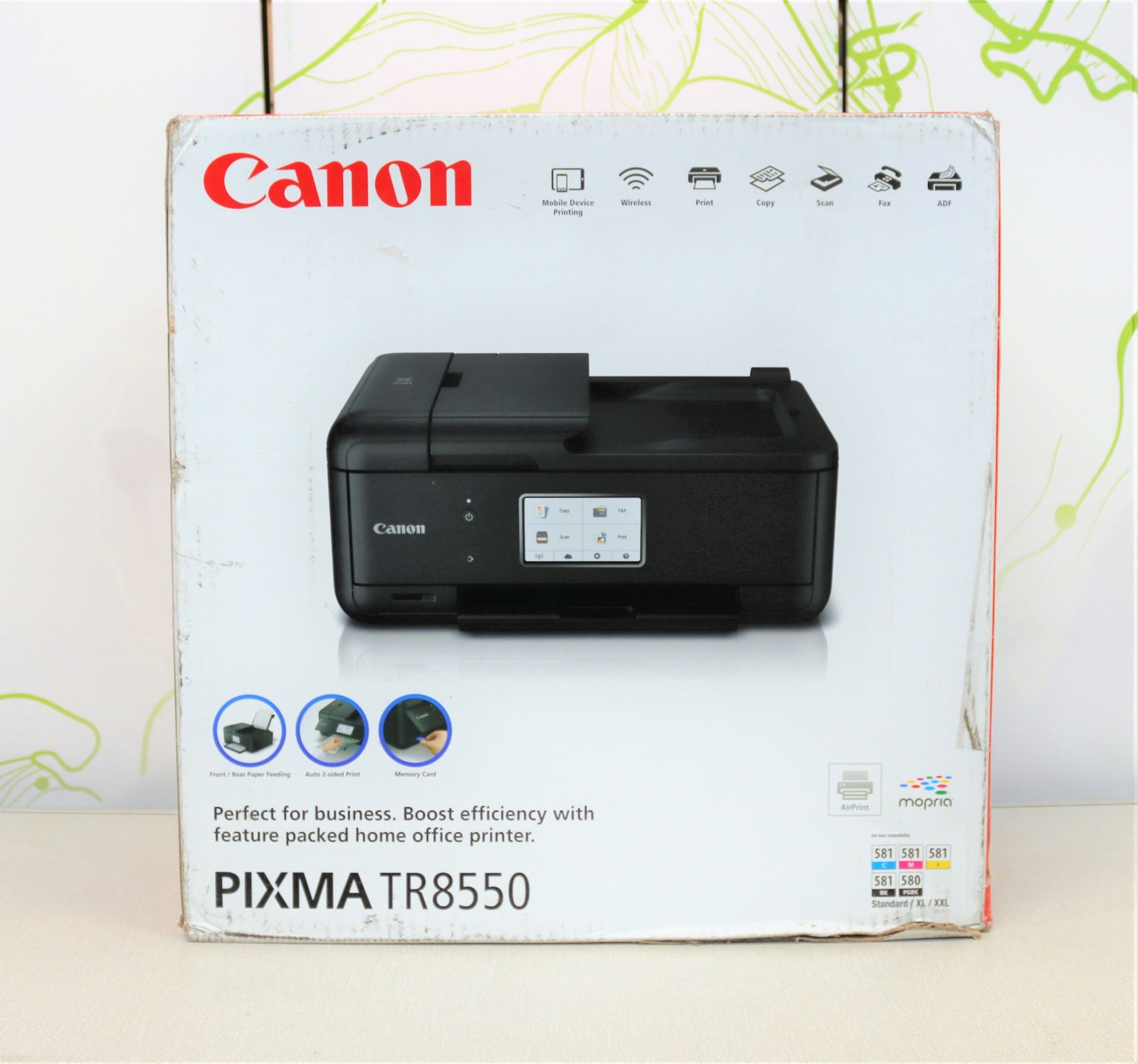 A boxed as new Canon Pixma TR8550 all-in-one printer in black. (box damaged)