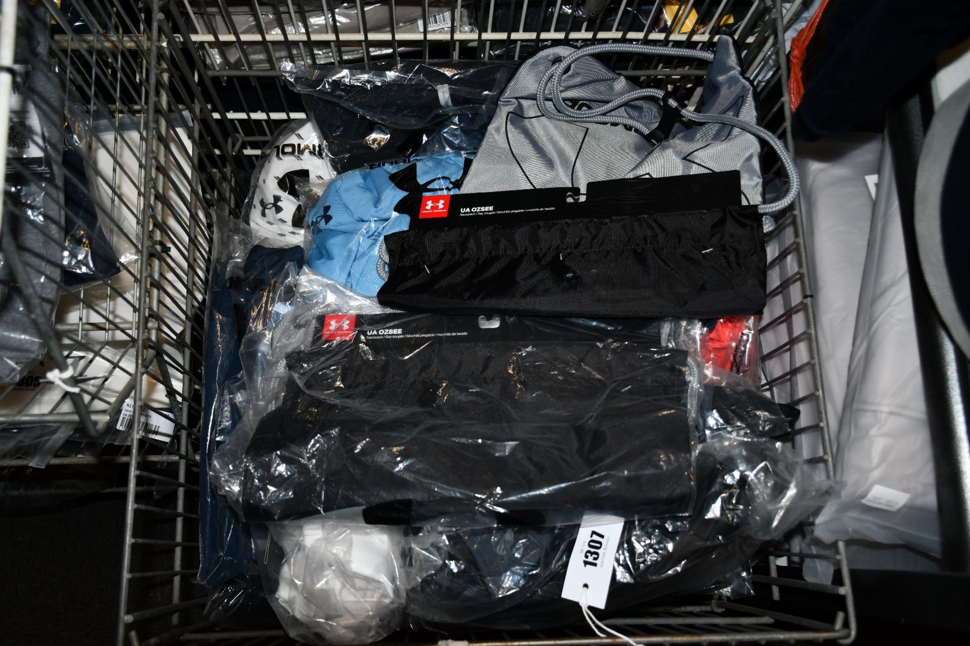 A quantity of as new Under Armour sportswear and accessories.