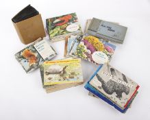 A collection of Cigarette, Tea and Trading cards including Wills, Players and Brook Bond.