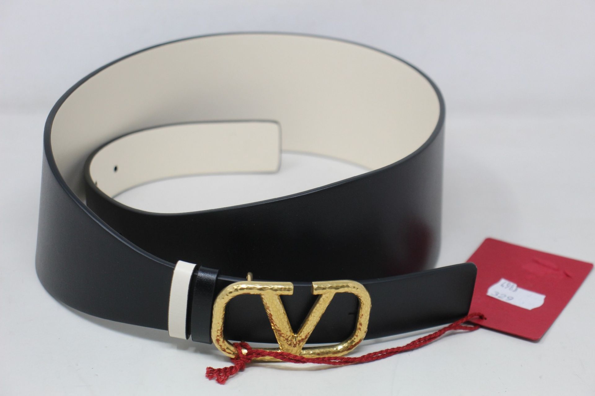 An as new Valentino black leather belt (Size 80).